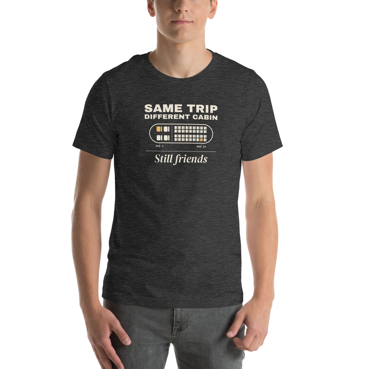 Unisex t-shirt in dark grey heather with a seat map with one amber seat in row 1 and one in row 34 and cream type reading same trip, different cabin, still friends
