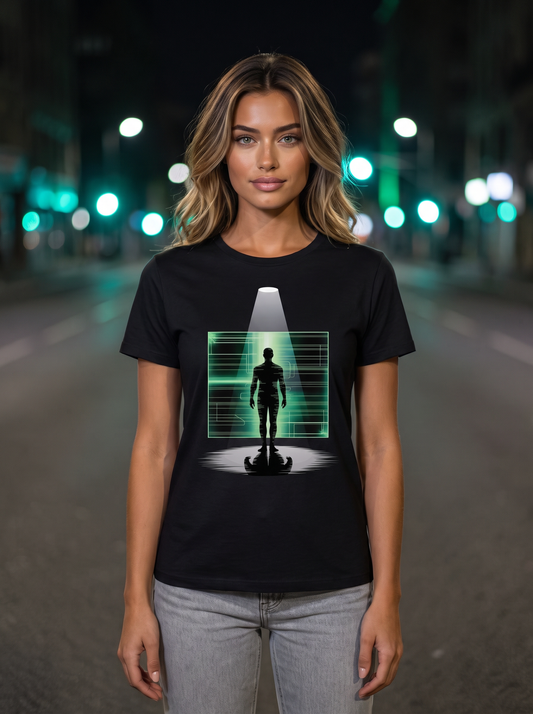 Seloura standing on a quiet street at night with soft green lights behind her, wearing the unisex t-shirt in black with a figure standing under a spotlight in front of a glowing green circuit grid. Model: Seloura (AI brand character). AI-generated model image; the printed design is the actual product artwork.