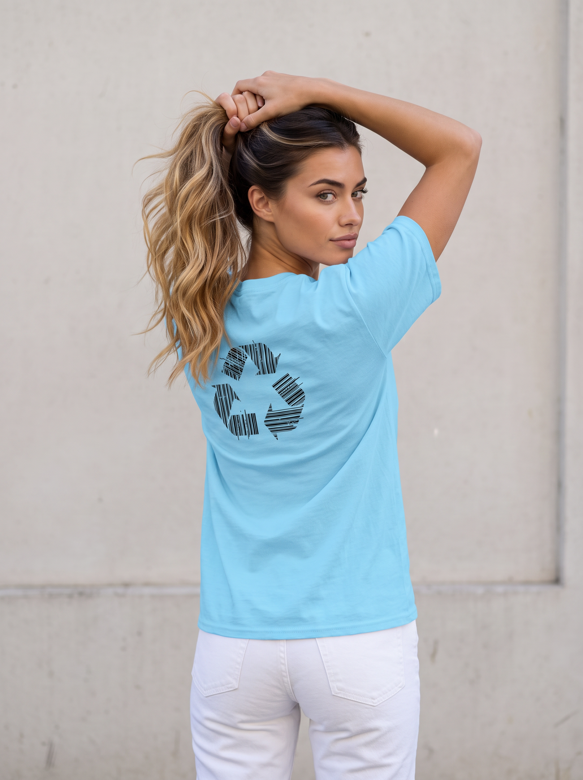 Seloura seen from behind, lifting her hair up and looking back over her shoulder, wearing the unisex t-shirt in sky blue with a recycling symbol made of barcodes printed on the back. Model: Seloura (AI brand character). AI-generated model image; the printed design is the actual product artwork.