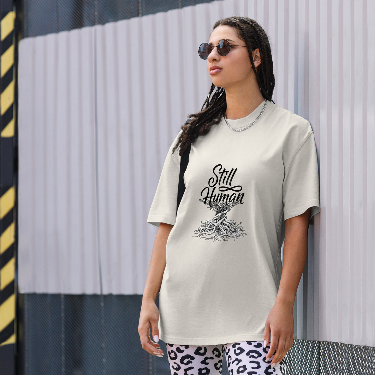 Oversized garment-dyed t-shirt with a still human circuit graphic, bone colorway