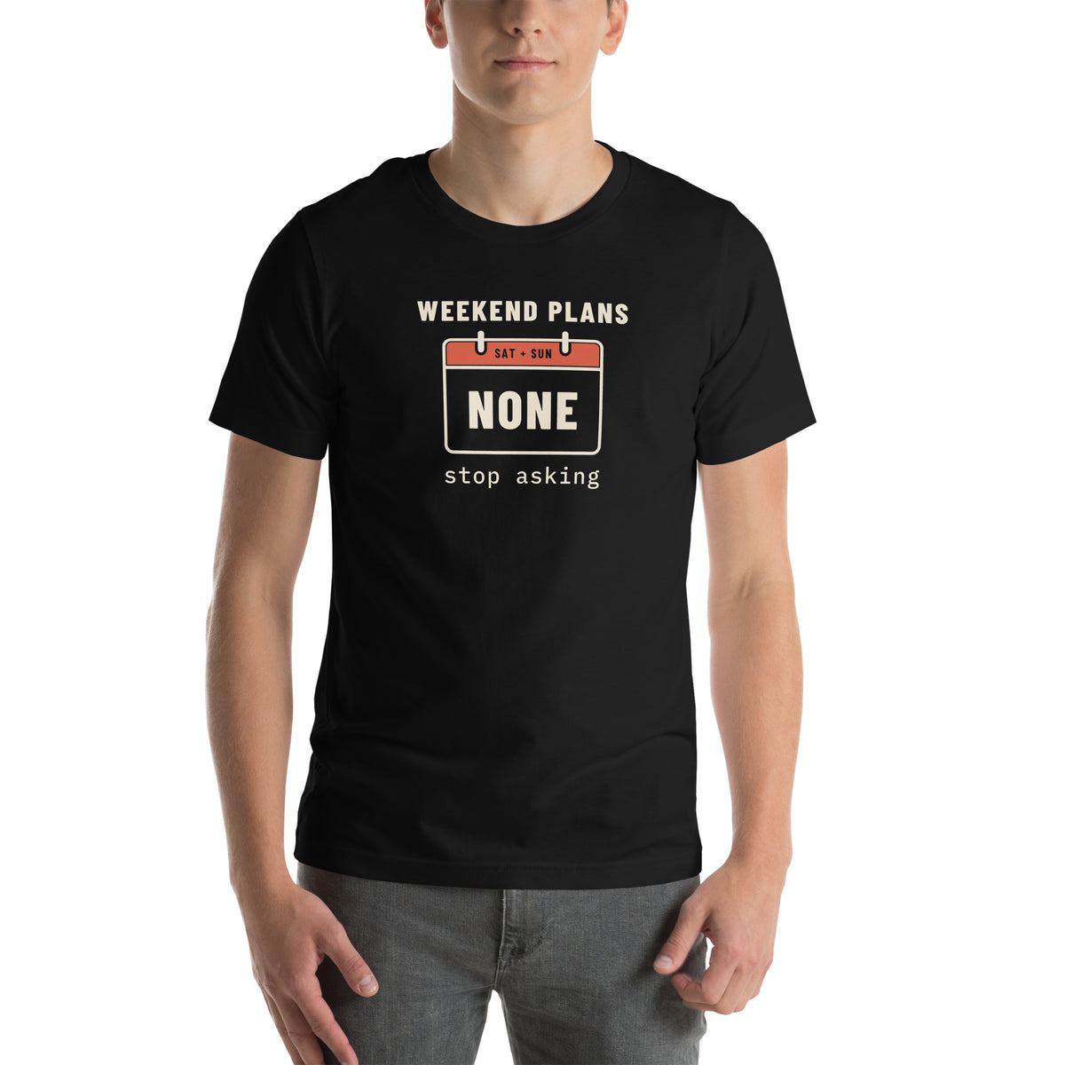 Unisex t-shirt in black with a calendar page for Saturday and Sunday reading none and cream type reading weekend plans, stop asking