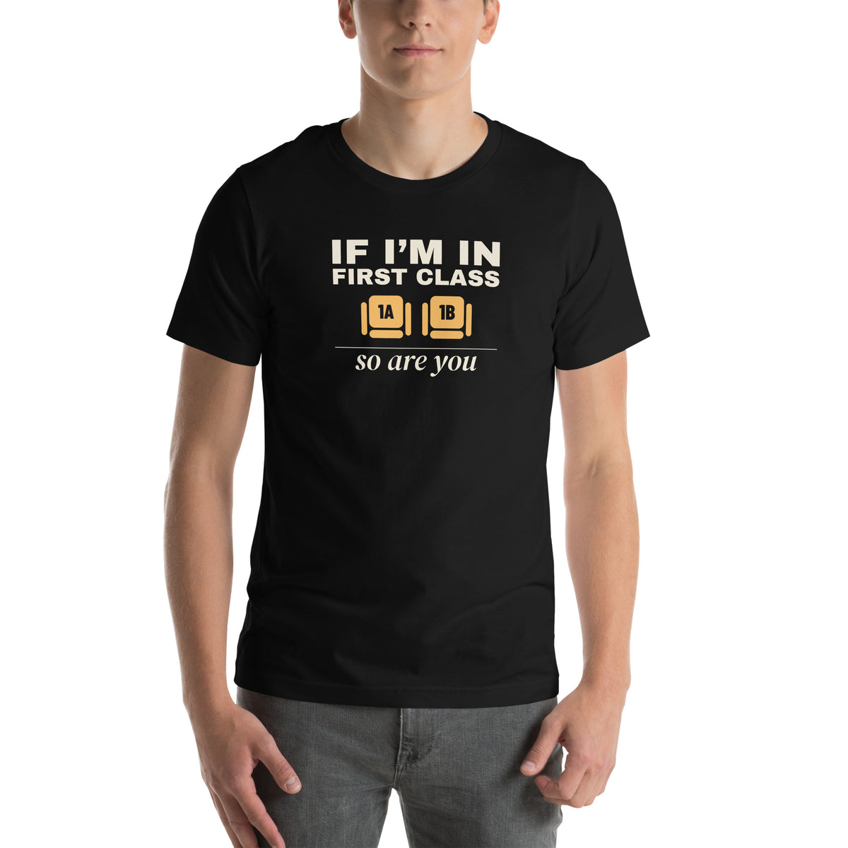 Unisex t-shirt in black with two wide seats marked 1A and 1B in amber and cream type reading if I'm in first class, so are you
