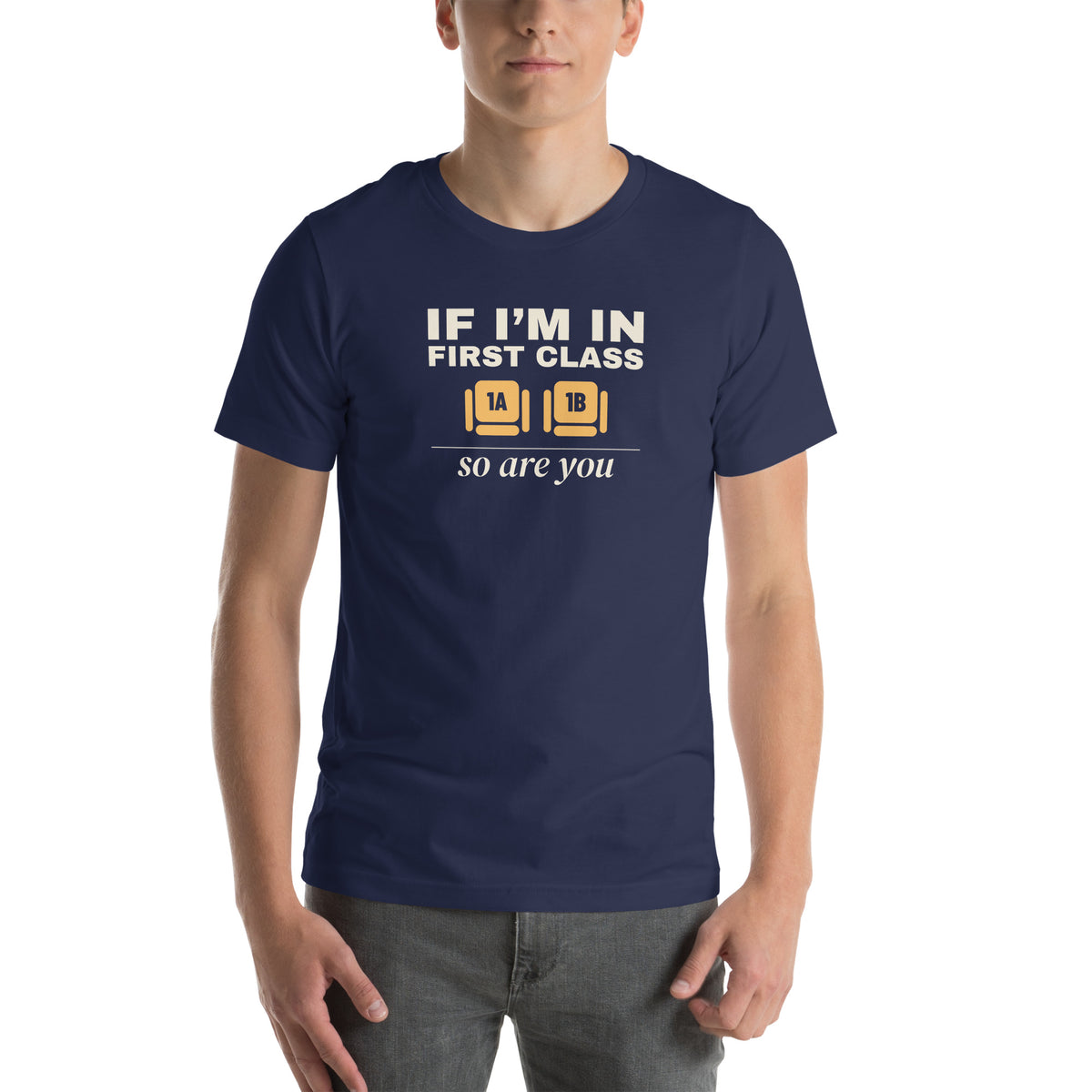 Unisex t-shirt in navy with two wide seats marked 1A and 1B in amber and cream type reading if I'm in first class, so are you